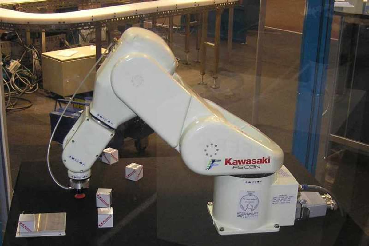 An industrial robot arm on a packing line at a distribution centre.