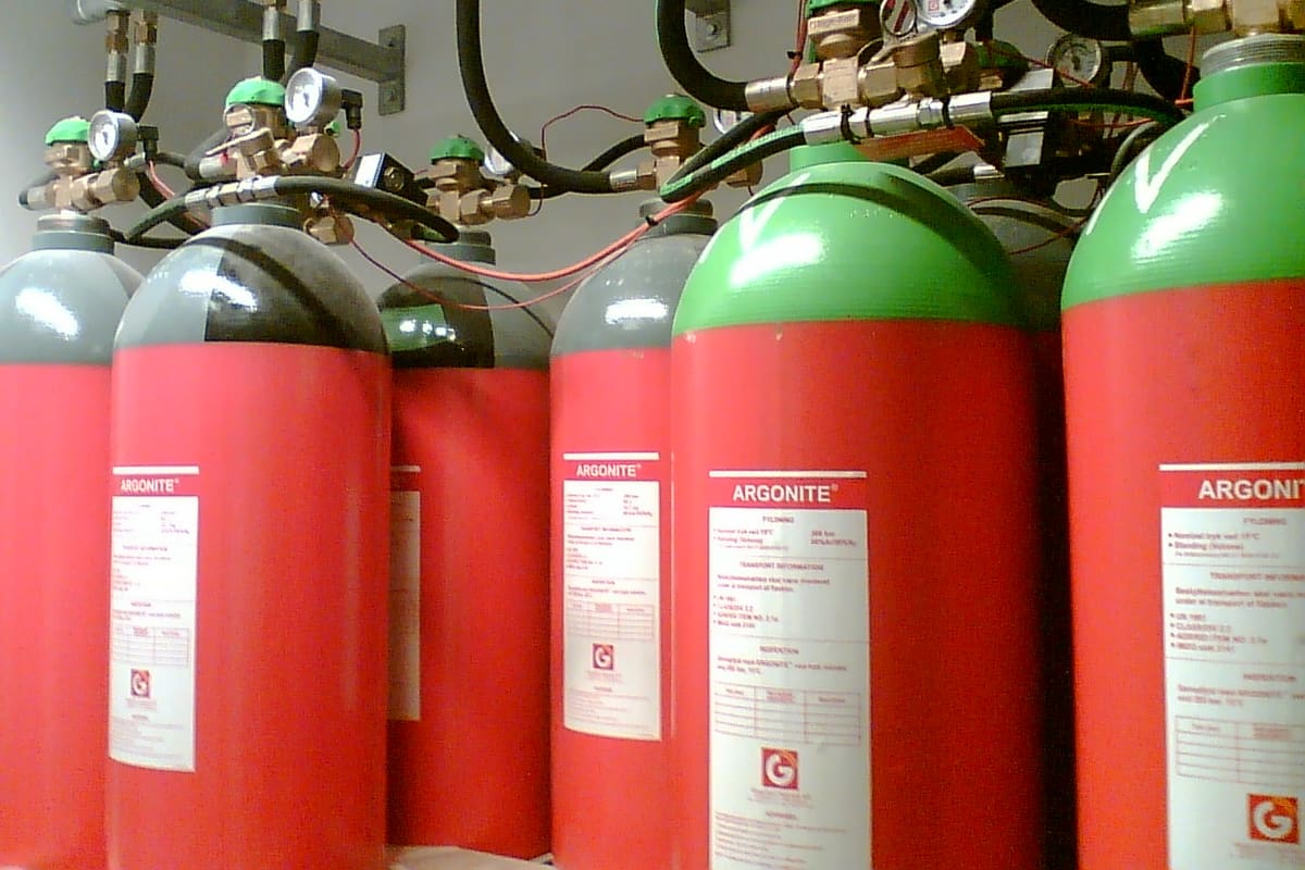 Process gas cylinders at a semiconductor fabrication plant during commissioning.