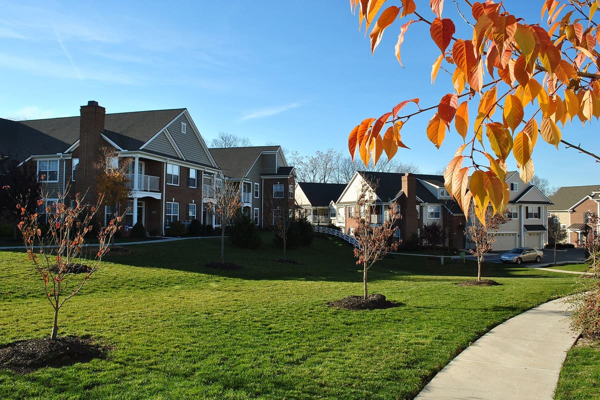 A suburban street of recently completed homes. Builders are pulling permits and not breaking ground.