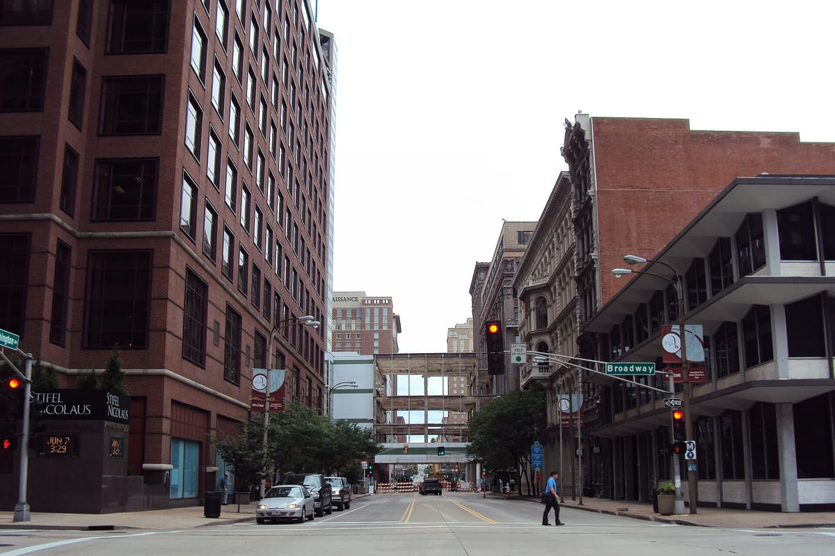 A city street on an ordinary afternoon. Nearly every large department now issues body-worn cameras.