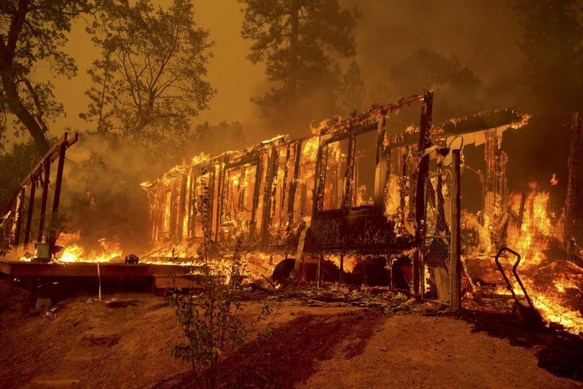 Crews work a ridge line as the Hawk Ridge Fire moves east toward populated canyons.